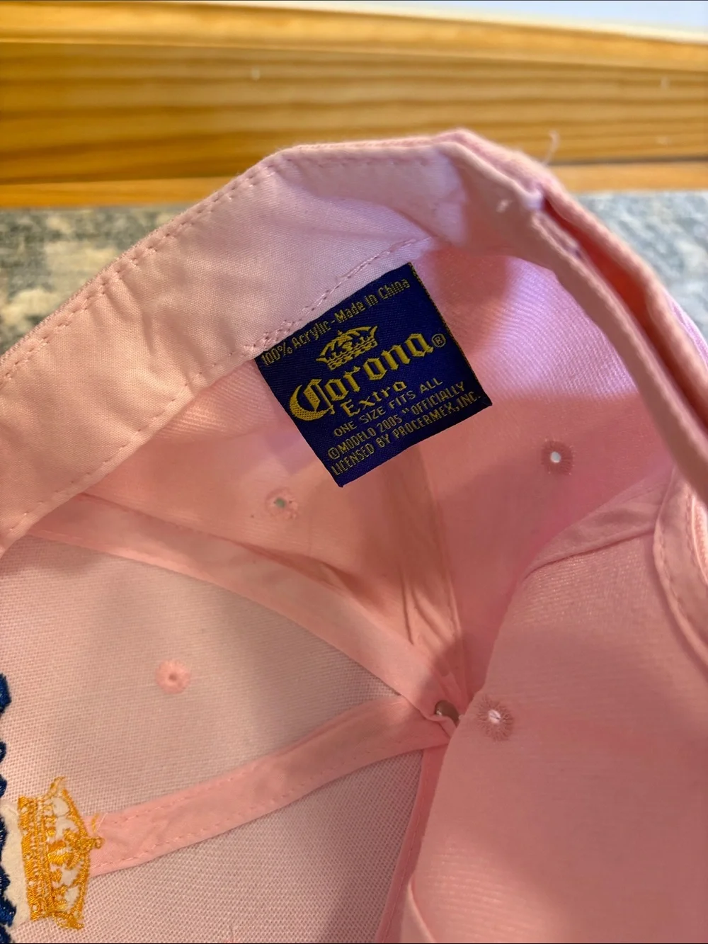 Corona Pink Hat with Navy Label and Gold Crown Stitching
